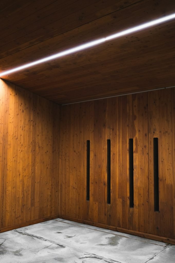 a-room-with-wooden-walls-and-a-concrete-floor-5mytqtjh5nc a-room-with-wooden-walls-and-a-concrete-floor-5mytqtjh5nc